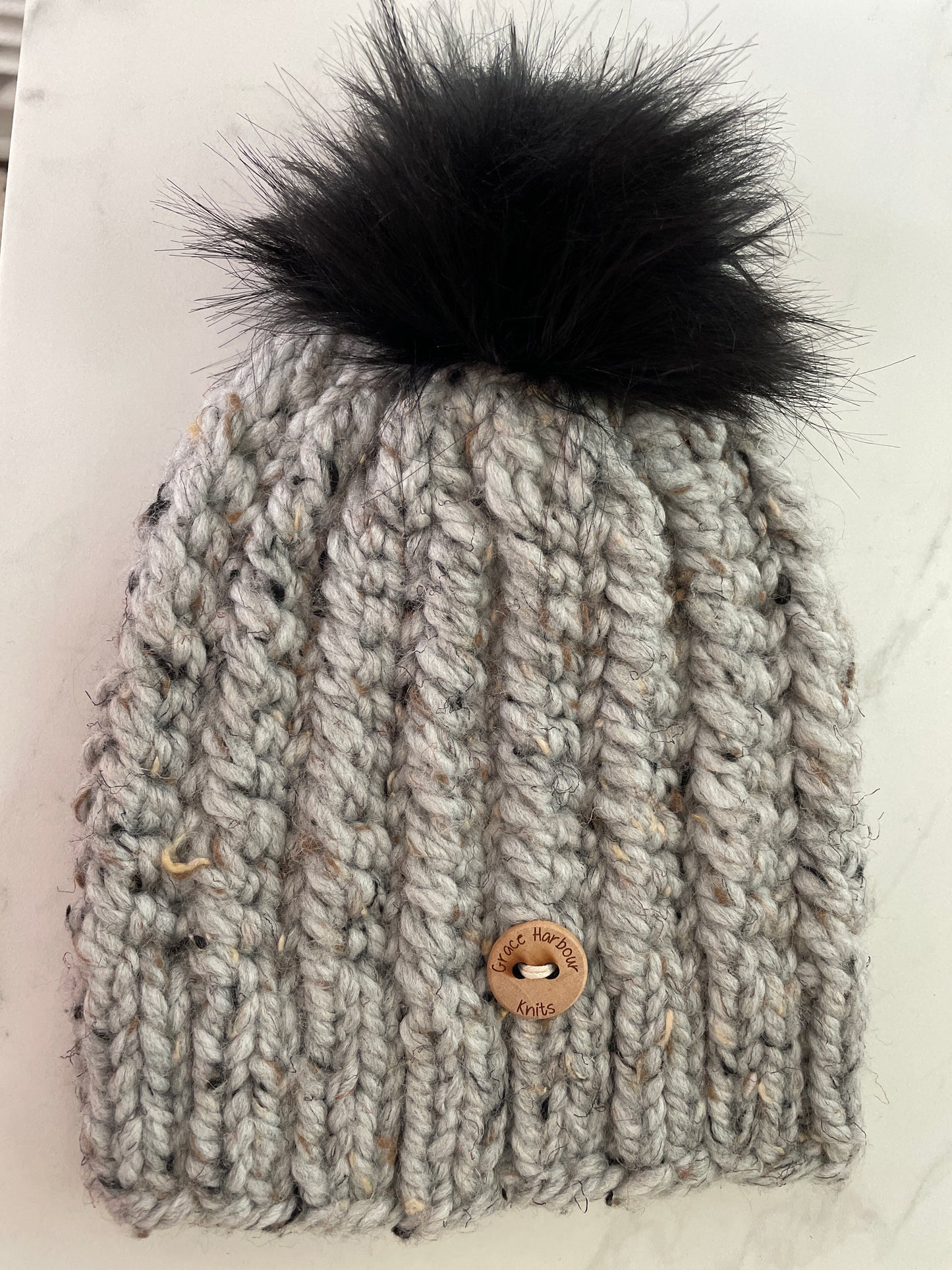 Corkscrew beanie in grey marble with Black Pom