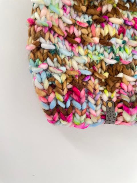 Multicolored crocheted blanket on a white background