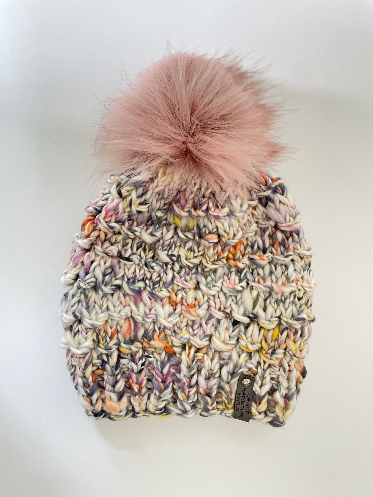 BAMBOO BEANIE IN NEUTRAL MULTI COLOURS, WITH BLUSH FAUX FUR POM POM