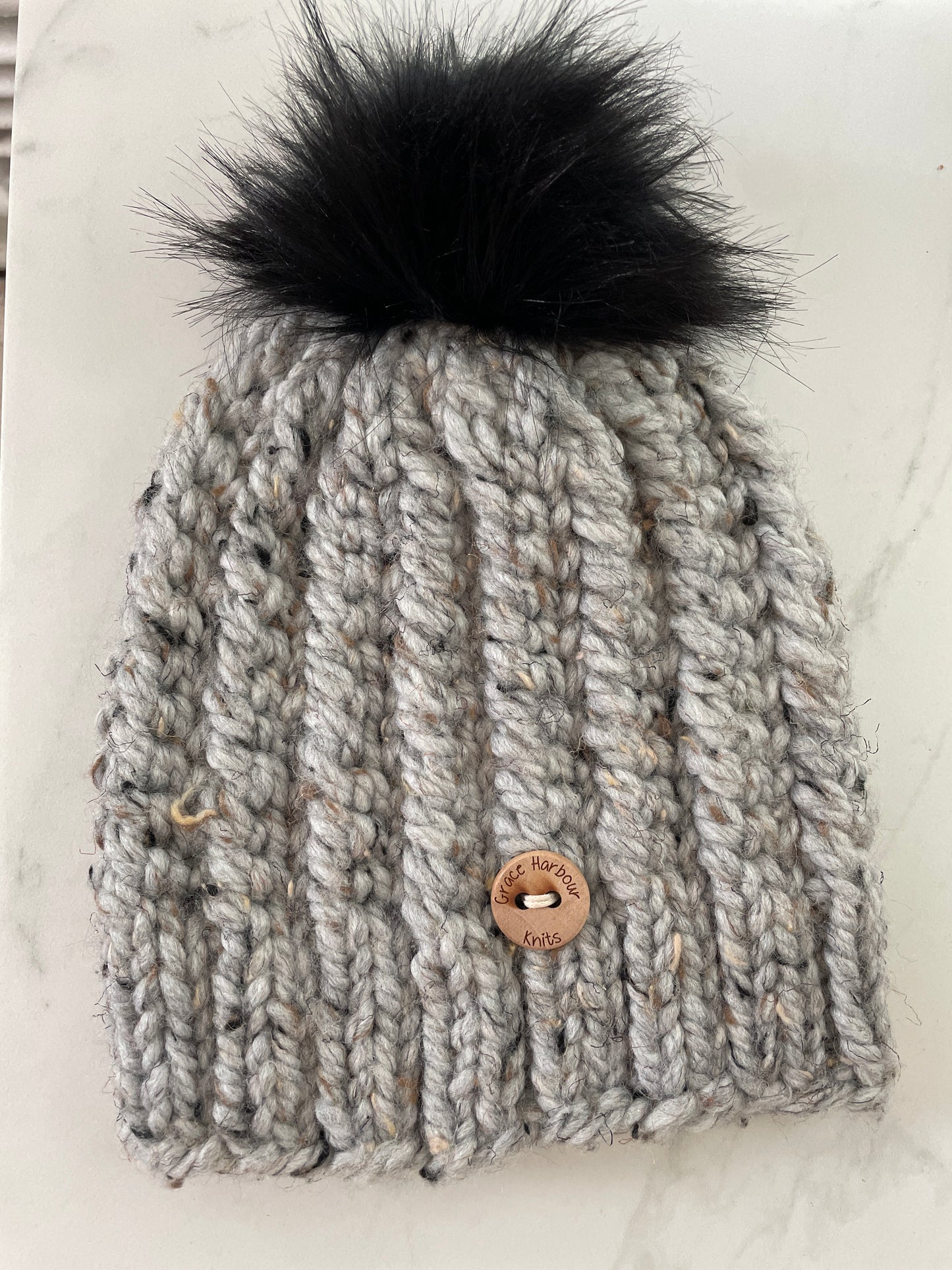Corkscrew beanie in grey marble with Black Pom