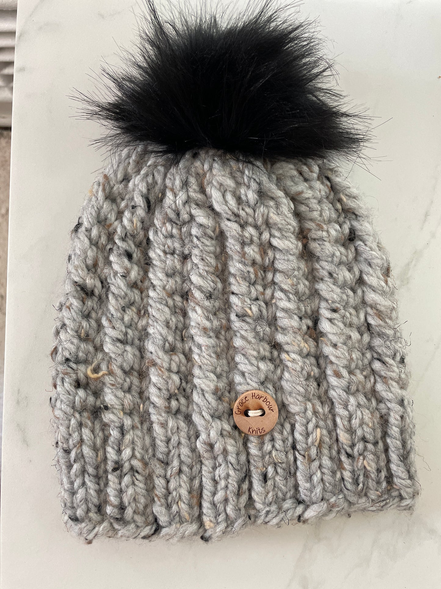 Corkscrew beanie in grey marble with Black Pom