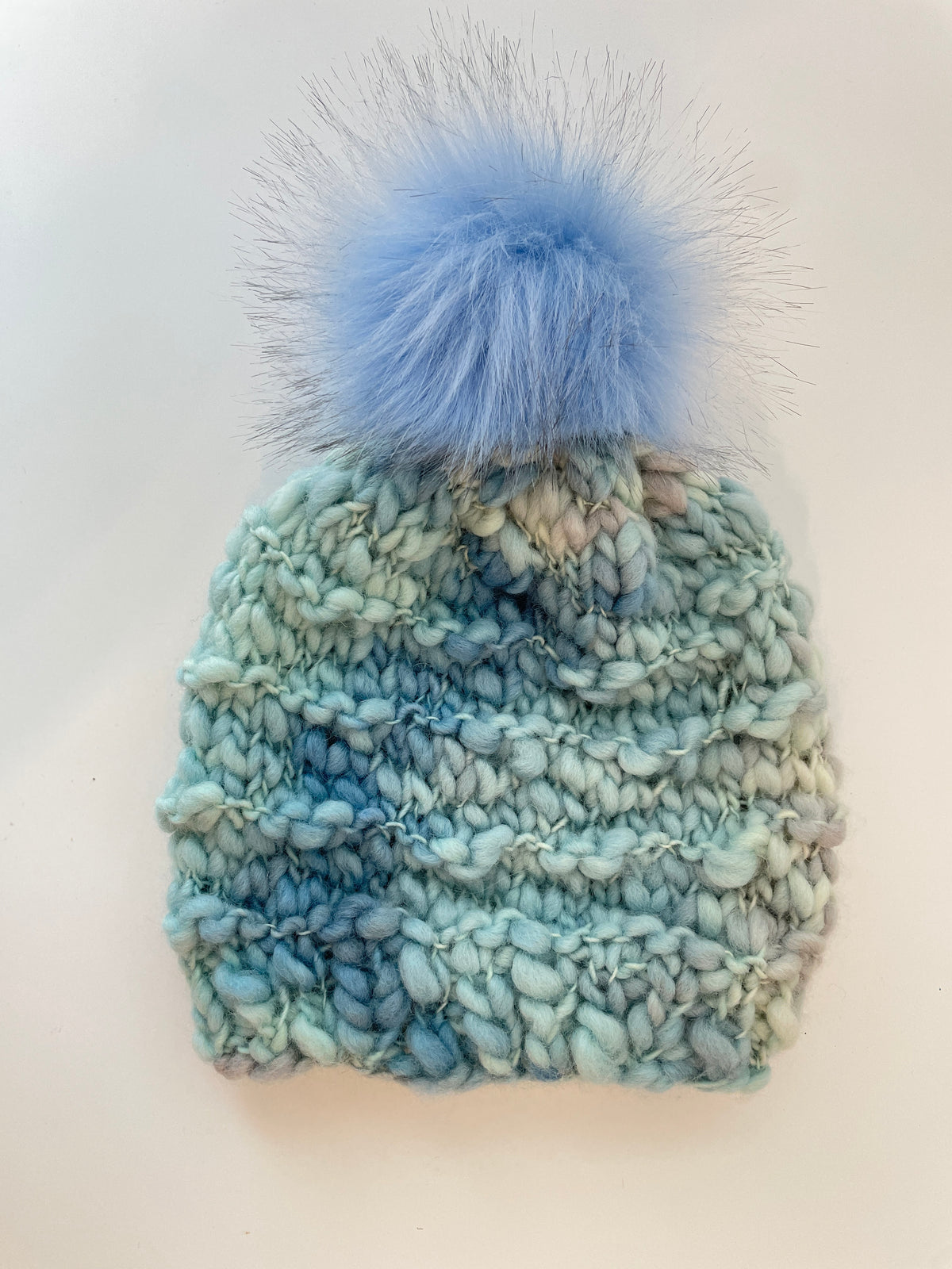 WAVE OVER WAVE IN SIRMILIK WITH LIGHT BLUE POM
