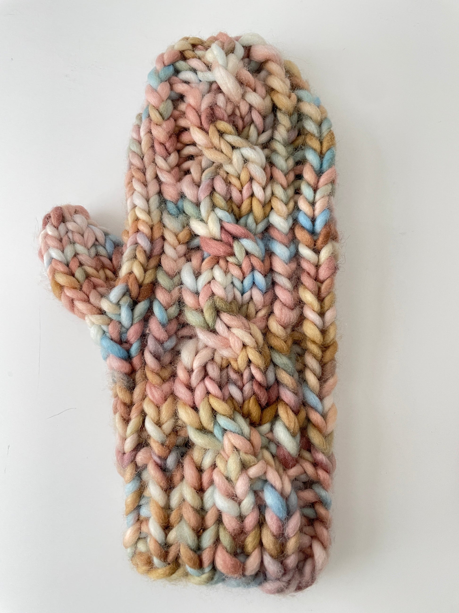Multicolored knitted headband on a white background