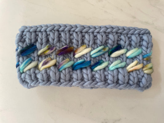 knit headband with colourful leaves on a light background