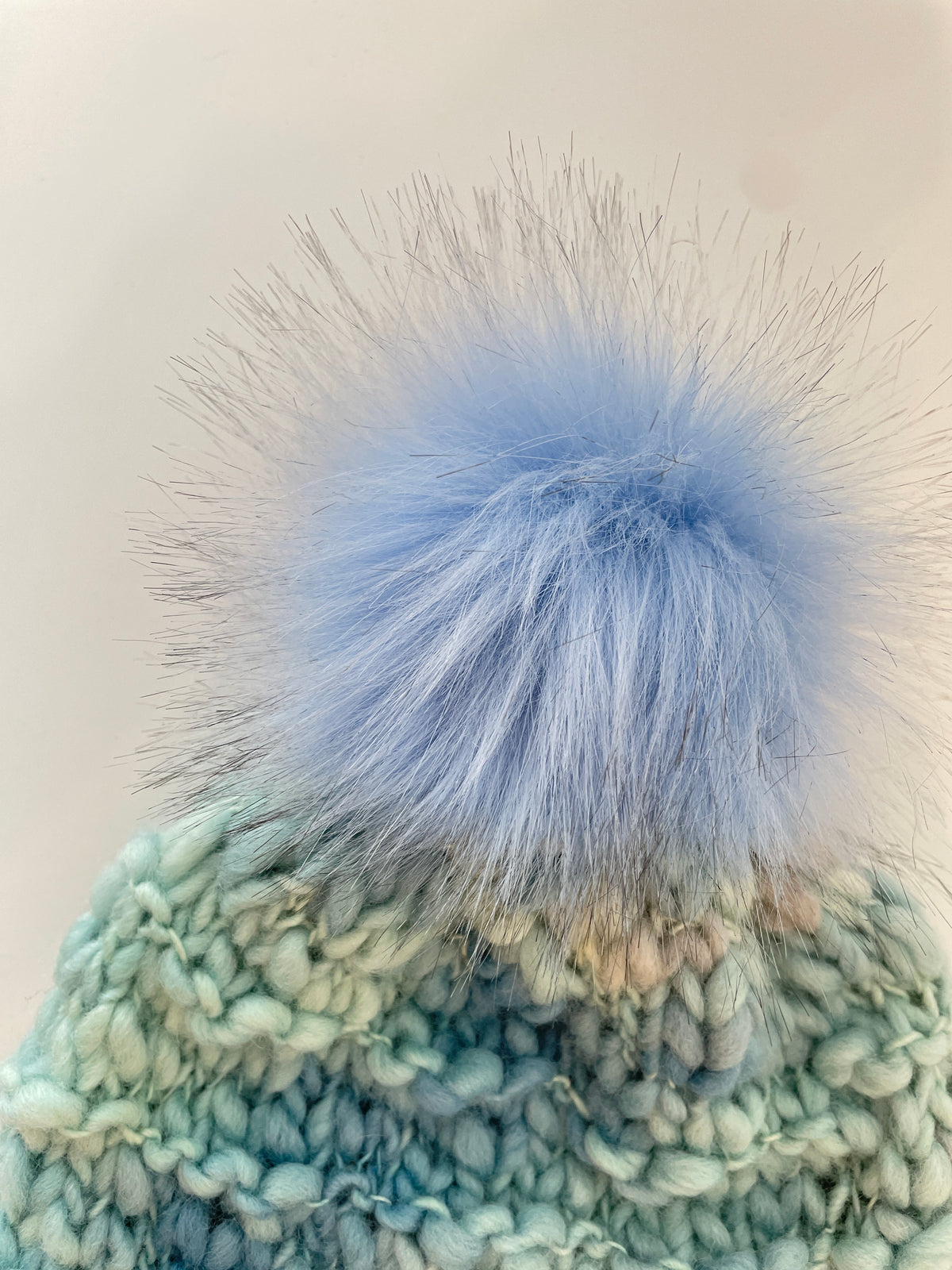 WAVE OVER WAVE IN SIRMILIK WITH LIGHT BLUE POM