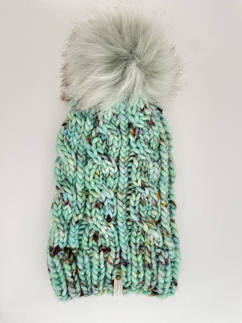GRACE CABLE KNIT BEANIE IN SEAS THE DAY WITH PISTACHIO POM