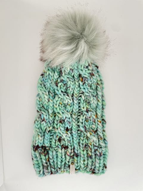 GRACE CABLE KNIT BEANIE IN SEAS THE DAY WITH PISTACHIO POM