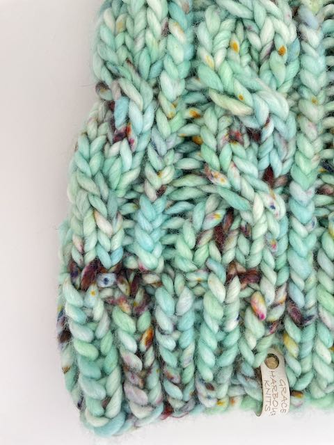 GRACE CABLE KNIT BEANIE IN SEAS THE DAY WITH PISTACHIO POM