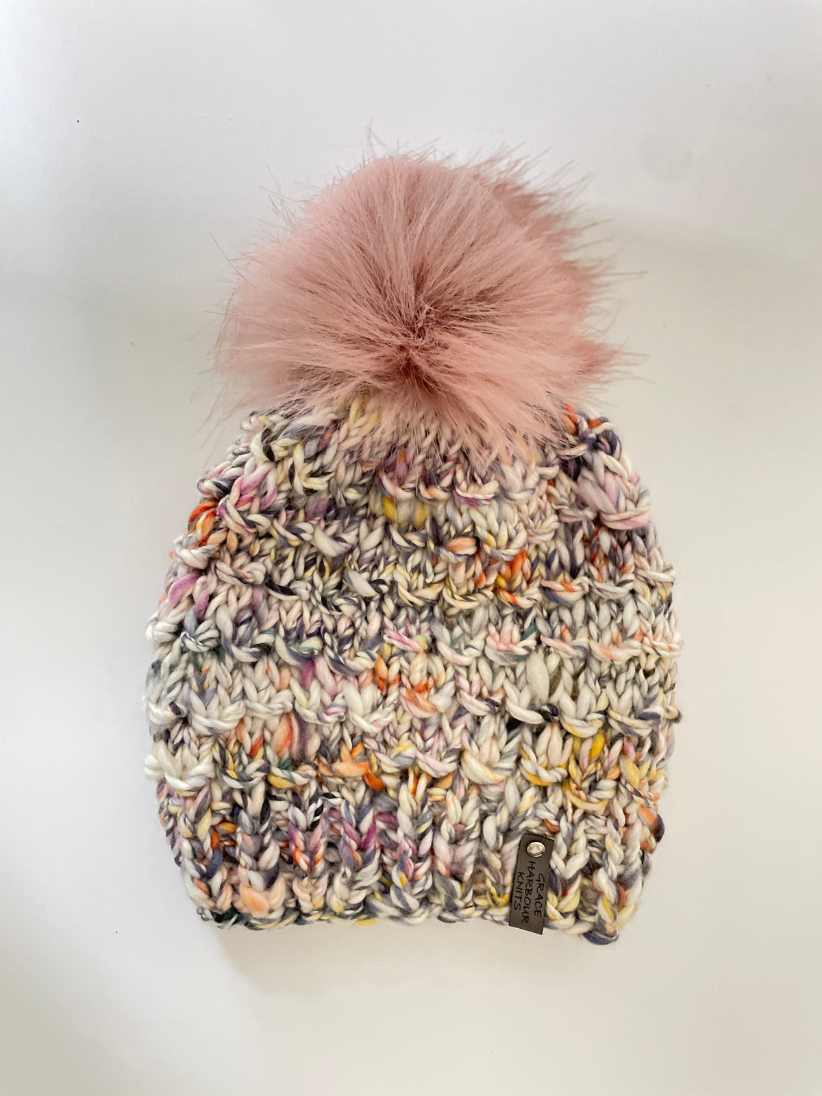 BAMBOO BEANIE IN NEUTRAL MULTI COLOURS, WITH BLUSH FAUX FUR POM POM